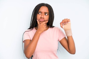 black pretty woman thinking, feeling doubtful and confused. broken hand concept