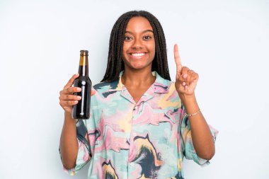 black pretty woman smiling and looking friendly, showing number one beer and holidays concept
