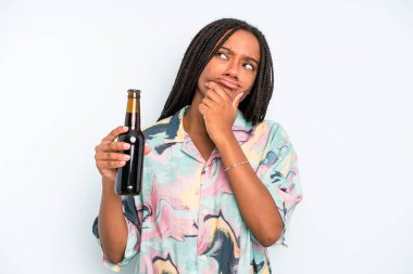 black pretty woman thinking, feeling doubtful and confused beer and holidays concept