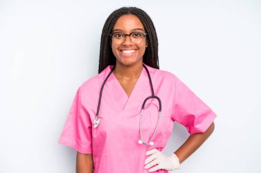 black pretty woman smiling happily with a hand on hip and confident. nurse concept