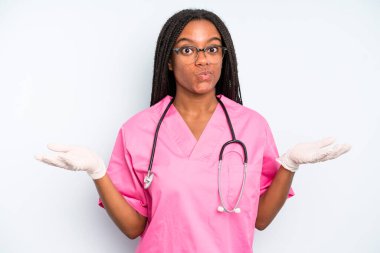 black pretty woman feeling puzzled and confused and doubting. nurse concept