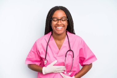 black pretty woman laughing out loud at some hilarious joke. nurse concept