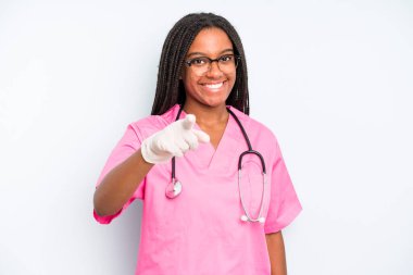 black pretty woman pointing at camera choosing you. nurse concept