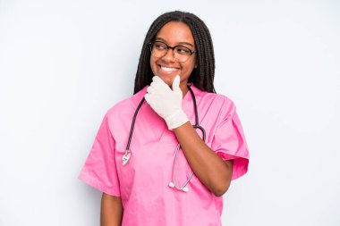 black pretty woman smiling with a happy, confident expression with hand on chin. nurse concept
