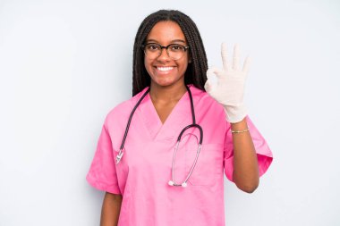 black pretty woman feeling happy, showing approval with okay gesture. nurse concept