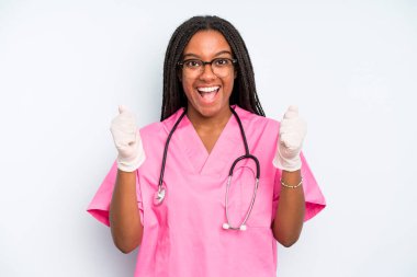 black pretty woman feeling shocked,laughing and celebrating success. nurse concept