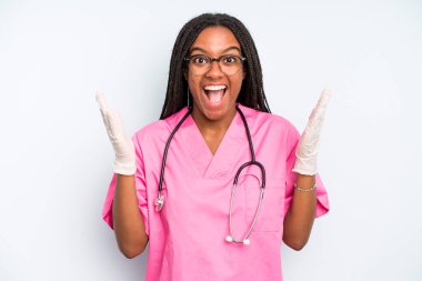 black pretty woman feeling happy and astonished at something unbelievable. nurse concept