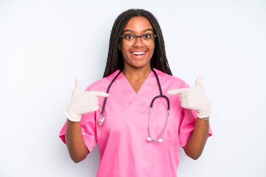 black pretty woman feeling happy and pointing to self with an excited. nurse concept