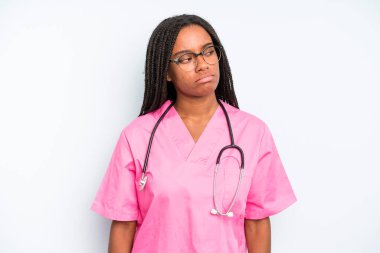 black pretty woman feeling sad, upset or angry and looking to the side. nurse concept