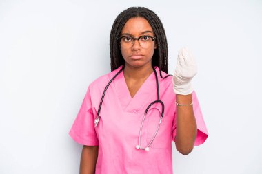 black pretty woman making capice or money gesture, telling you to pay. nurse concept