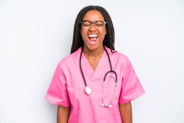 black pretty woman shouting aggressively, looking very angry. nurse concept