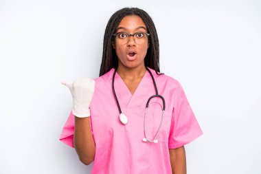 black pretty woman looking astonished in disbelief. nurse concept