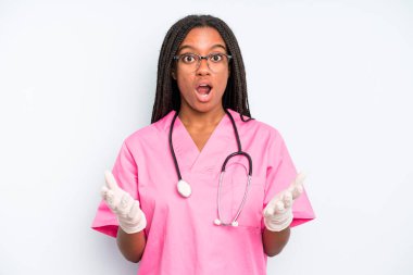 black pretty woman amazed, shocked and astonished with an unbelievable surprise. nurse concept