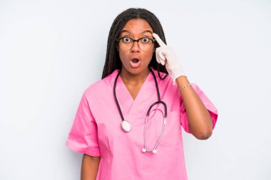 black pretty woman looking surprised, realizing a new thought, idea or concept. nurse concept
