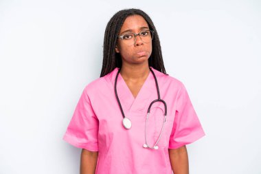 black pretty woman feeling sad and whiney with an unhappy look and crying. nurse concept