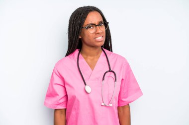 black pretty woman feeling puzzled and confused. nurse concept