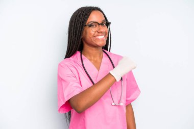 black pretty woman feeling happy and facing a challenge or celebrating. nurse concept