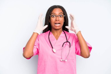 black pretty woman screaming with hands up in the air. nurse concept