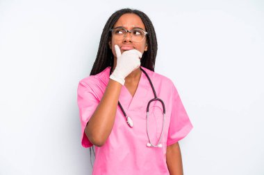black pretty woman thinking, feeling doubtful and confused. nurse concept