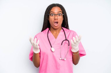 black pretty woman feeling extremely shocked and surprised. nurse concept