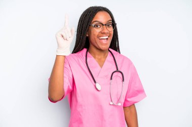 black pretty woman feeling like a happy and excited genius after realizing an idea. nurse concept