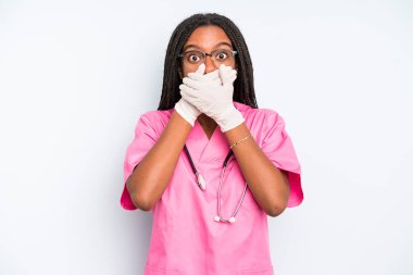 black pretty woman covering mouth with hands with a shocked. nurse concept