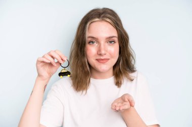 caucasian pretty woman smiling happily with friendly and  offering and showing a concept. new car concept