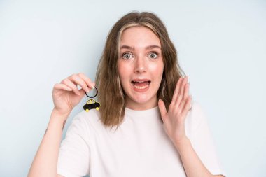 caucasian pretty woman feeling happy and astonished at something unbelievable. new car concept