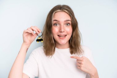 caucasian pretty woman feeling happy and pointing to self with an excited. new car concept