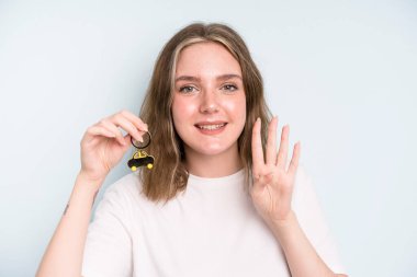 caucasian pretty woman smiling and looking friendly, showing number four. new car concept