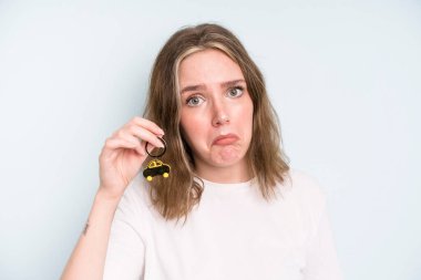 caucasian pretty woman feeling sad and whiney with an unhappy look and crying. new car concept