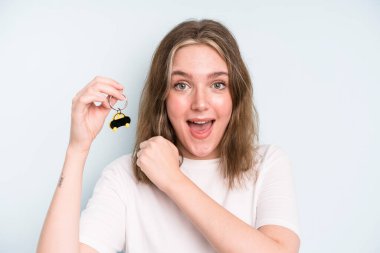 caucasian pretty woman feeling happy and facing a challenge or celebrating. new car concept