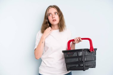 caucasian pretty woman feeling stressed, anxious, tired and frustrated. empty shopping basket concept