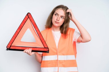 caucasian pretty woman feeling puzzled and confused, scratching head. car emergency concept