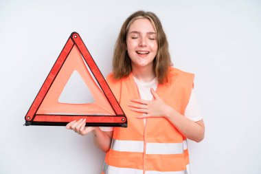 caucasian pretty woman laughing out loud at some hilarious joke. car emergency concept