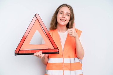 caucasian pretty woman feeling proud,smiling positively with thumbs up. car emergency concept