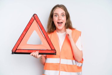 caucasian pretty woman feeling shocked,laughing and celebrating success. car emergency concept