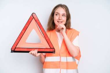 caucasian pretty woman smiling with a happy, confident expression with hand on chin. car emergency concept