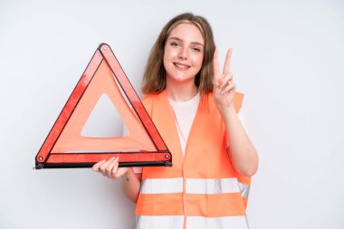 caucasian pretty woman smiling and looking happy, gesturing victory or peace. car emergency concept