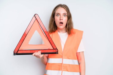 caucasian pretty woman looking very shocked or surprised. car emergency concept