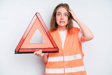 caucasian pretty woman feeling stressed, anxious or scared, with hands on head. car emergency concept