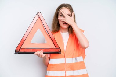 caucasian pretty woman looking shocked, scared or terrified, covering face with hand. car emergency concept