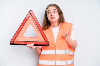 caucasian pretty woman shrugging, feeling confused and uncertain. car emergency concept