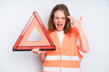 caucasian pretty woman looking unhappy and stressed, suicide gesture making gun sign. car emergency concept