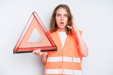 caucasian pretty woman screaming with hands up in the air. car emergency concept