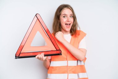 caucasian pretty woman feeling happy and facing a challenge or celebrating. car emergency concept