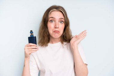 caucasian pretty woman feeling puzzled and confused and doubting. smoker with a vaper concept