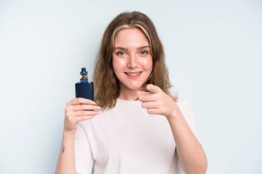 caucasian pretty woman pointing at camera choosing you. smoker with a vaper concept