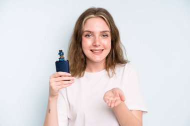 caucasian pretty woman smiling happily with friendly and  offering and showing a concept. smoker with a vaper concept