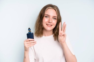 caucasian pretty woman smiling and looking friendly, showing number three. smoker with a vaper concept